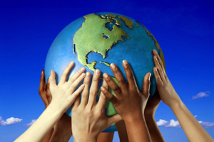 HANDS ON A GLOBE- Image by © Royalty-Free/Corbis