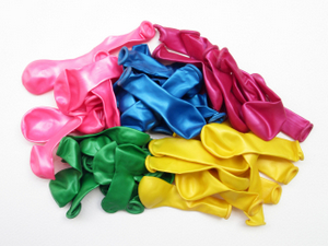 PILE OF UNINFLATED BALLOONS FROM DIFFERENT COLORS © Srckomkrit | Dreamstime.com